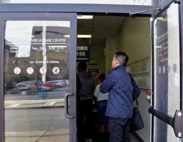   Customers line up at the PennDOT Driver License Center at Eight and Arch streets in Philadelphia. (Emma Lee/WHYY, file)  