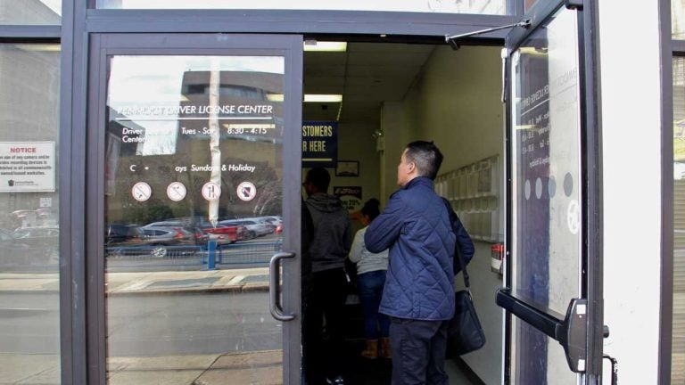   Customers line up at the PennDOT Driver License Center at Eight and Arch streets in Philadelphia. (Emma Lee/WHYY, file)  