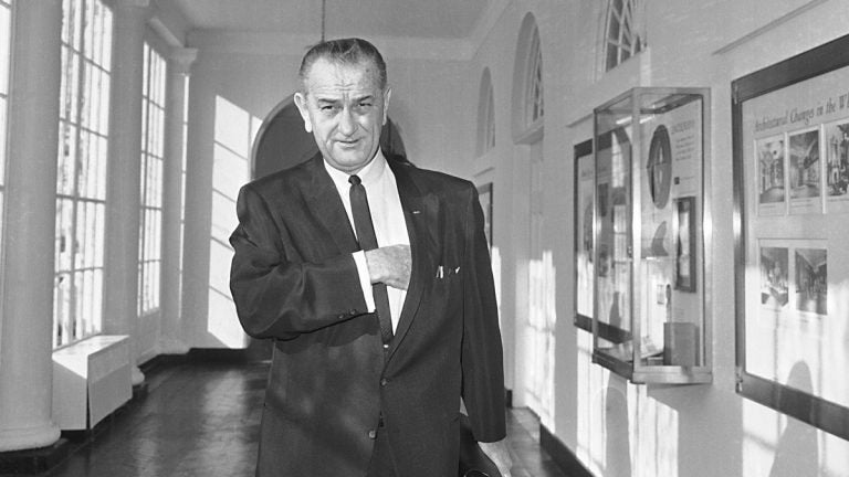 President Lyndon Johnson walks from his office in the White House to a studio in the Executive Mansion to address the nation on the bombing of North Vietnam, Jan. 31, 1966. (AP Photo, file)