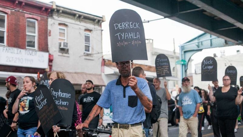 Hundreds march up Kensington Avenue Thursday for the March in Black in remembrance of those who have died from opioid overdoses. (Brad Larrisonf or NewsWorks)