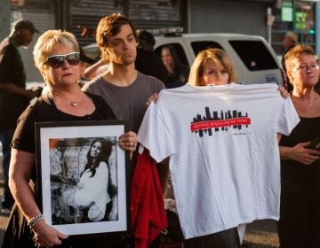Donna Morgan, (left), stands with a picture of her daughter Brittany who died of a heroin overdose in May 2017 along with her son Nathan and friend Robin D'Angleo whose son is in recovery for heroin addiction. (Brad Larrison for NewsWorks)