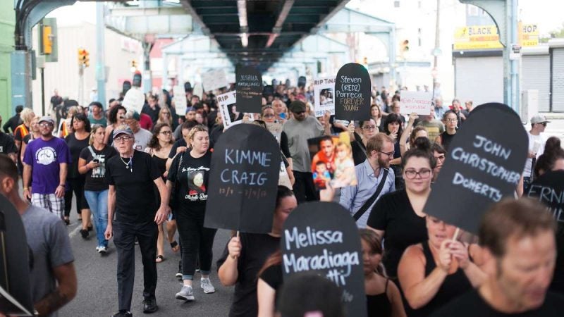 Hundreds march up Kensington Avenue Thursday for the March in Black in remembrance of those who have died from opioid overdoses. (Brad Larrison for NewsWorks)