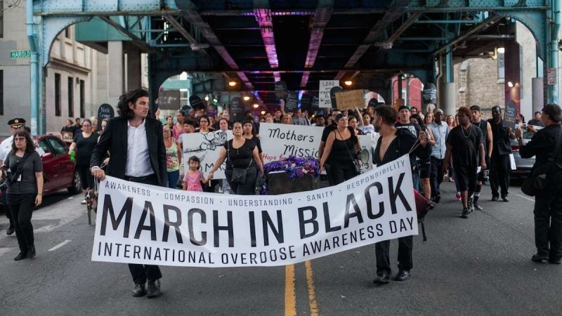 Hundreds march up Kensington Avenue Thursday for the March in Black in remembrance of those who have died from opioid overdoses. (Brad Larrison for NewsWorks)