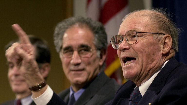 Robert McNamara, right, defense secretary under Presidents Kennedy and Johnson, is shown in 2001 at a forum at the John F. Kennedy School of Government at Harvard University in Cambridge, Mass. (AP Photo/Steven Senne, File)