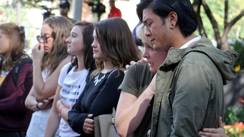 Students attend a memorial service for Jenna Burleigh, a Temple University student who was murdered after leaving a bar near campus with a man who is accused of killing her.