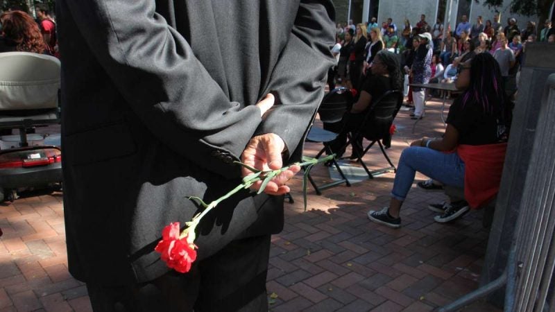 Members of Temple Student Government and Progressive NAACP, who organized the memorial service, passed out red carnations to attendees.