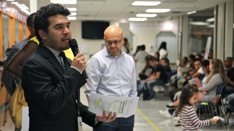  Carlos Torres at the Mexican consulate in Philadelphia provides updates on the earthquake in southern Mexico, then asks for donations and a moment of silence. (Emma Lee/WHYY) 