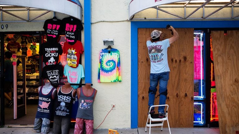 Jone Yoon boards up his beach souvenir shop ahead of Hurricane Irma in Daytona Beach, Fla., Thursday, Sept. 7, 2017. (AP Photo/David Goldman) 