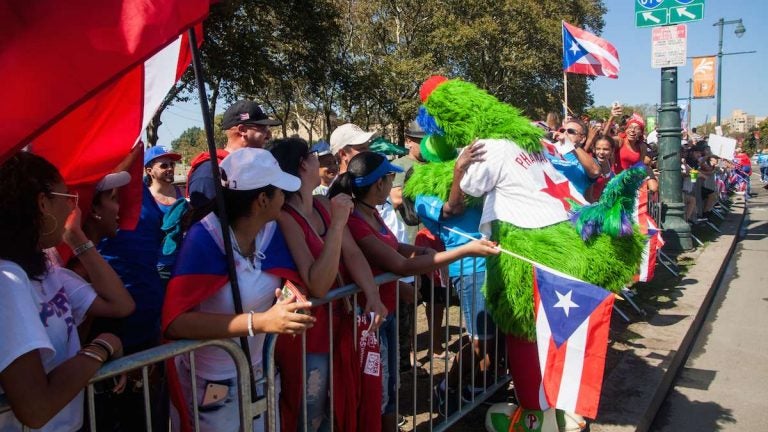 The Phillie Phanatic gives hugs on the Benjamin Franklin Parkway during the 2017 Puerto Rican Day Parade.