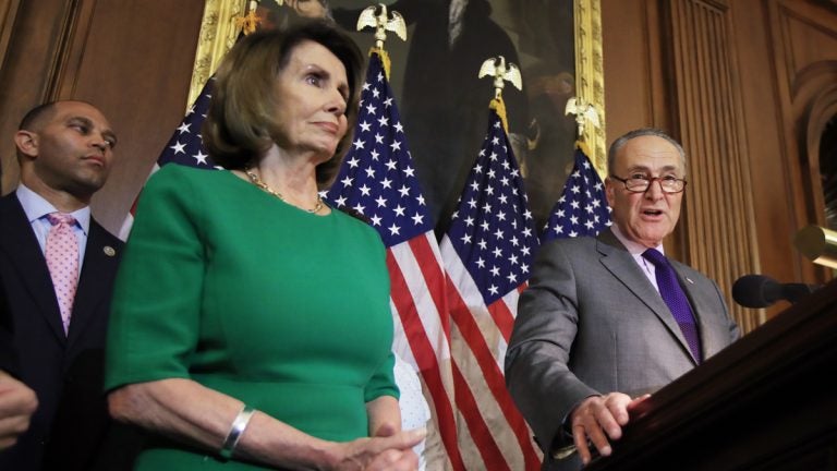 Senate Minority Leader Chuck Schumer of N.Y., right, with House Minority Leader Nancy Pelosi of Calif. and Rep. Hakeem Jeffries, D-N.Y., back left, speaks to reporters on Capitol Hi