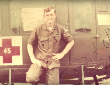 Doug Petersen stands by a Huey medevac helicopter in Vietnam. (photo courtesy Doug Petersen)