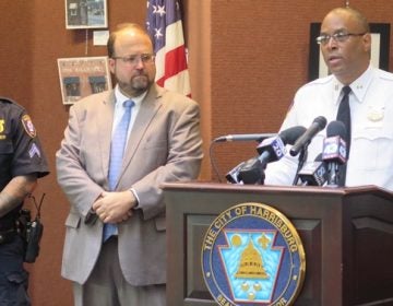 Harrisburg Police Officer Josh Hammer, Mayor Eric Papenfuse and Capt. Deric Moody address reporters during a press conference about the city's body cameras pilot program. (Emily Previti)