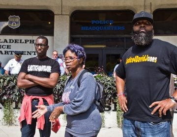 Asa Khalif, organizer of Black Lives Matter's Philadelphia chapter, Rowena Faulk, and Isaac Gardner, protested outside police headquarters Thursday to demand murder charges be brought against officer Pownall.