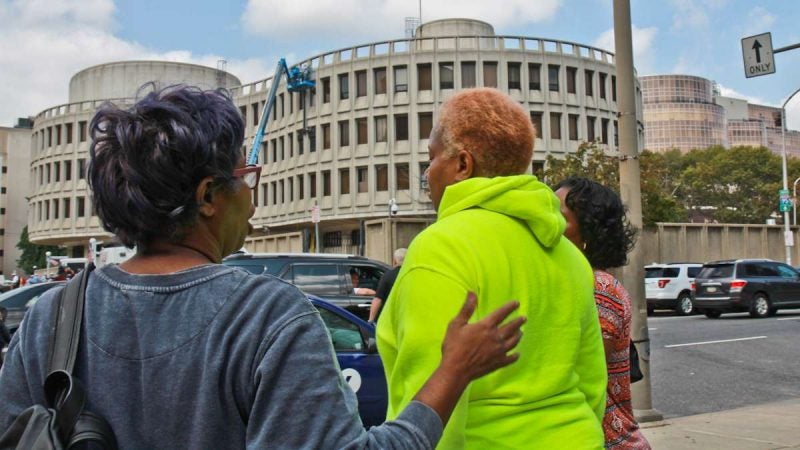 Rowena Faulk, an activist with Black Lives Matter, comforts Doretha Crosby, mother of David Jones.