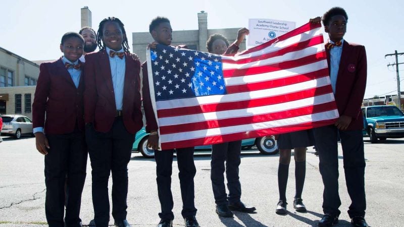 Students from Southwest Leadership Academy Charter School prepare to begin the Southwest Pride Day parade from 72nd Street and Woodland Avenue in Southwest Philadelphia. (Annie Risemberg for NewsWorks)