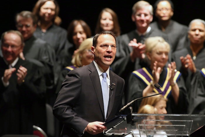 FILE- In this Jan. 17, 2017, file photo, Josh Shapiro speaks to the crowd after being sworn in as Pennsylvania's attorney general in Harrisburg, Pa. Attorneys general from Pennsylvania, New Mexico and more than a dozen other states are urging U.S. Education Secretary Betsy DeVos to keep in place protections for victims of sexual assault on college campuses. (AP Photo/Chris Knight, File)