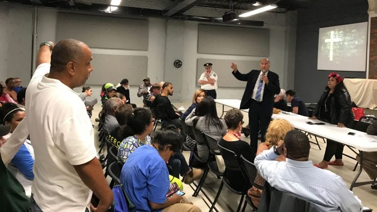  Local resident Rick Alvarez speaks with Councilman Mark Squilla at the Somerset Neighbors For Better Living meeting on Monday. (Joel Wolfram/For WHYY) 