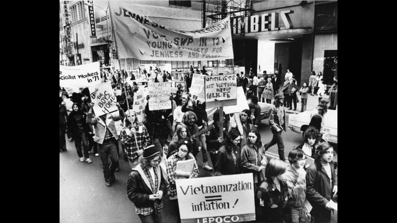 Anti-war demonstrators are shown marching along Market Street between Sixth and Eighth streets on Oct. 6, 1971. Gimbel Brothers and Horn and Hardart stores can be seen on the right. (Dominic Pasquarella / Courtesy of George D. McDowell Philadelphia Evening Bulletin Collection, Temple University Libraries)