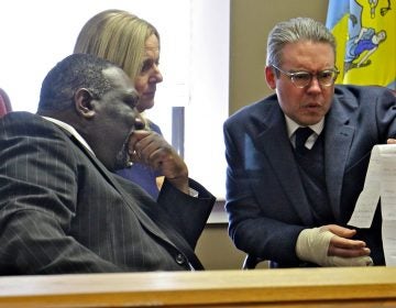  Philadelphia City Commissioners (from left) Anthony Clark, Lisa Deeley, and Al Schmidt, review write-in votes from the 197th legislative district special election in which more than 90 percent of the votes were write-ins. (Emma Lee/WHYY) 