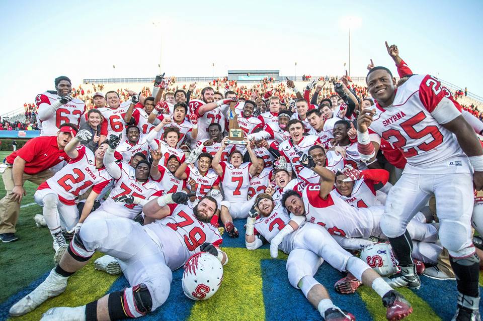 Smyrna High's football team rejoices on the field at the University of Delaware after winning its first state Division I football title in 2015 with a thrilling victory over perennial powerhouse Salesianum. (Courtesy of Smyrna High School)