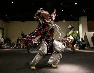 Aaron Miller of the Seneca Nation performs a smoke dance with members of the Longhouse Singers and Dancers at the Museum of the American Revolution.