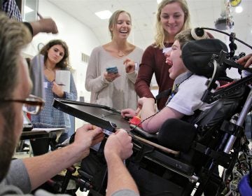 Temple occupational therapy students work to design a new wheelchair tray for Eddie