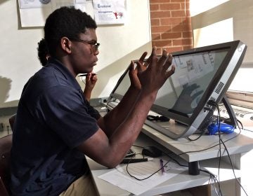 Oswald Darway, a 10th grader at Valley Day School, works with a virtual reality program.