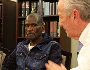 Kevin Brinkley (left) listens to an apology from attorney Gerald Dugan, who 40 years ago prosecuted the murder case that got Brinkley a life sentence. Dugan has since changed his mind about Brinkley's role in the murder of Charles Haag