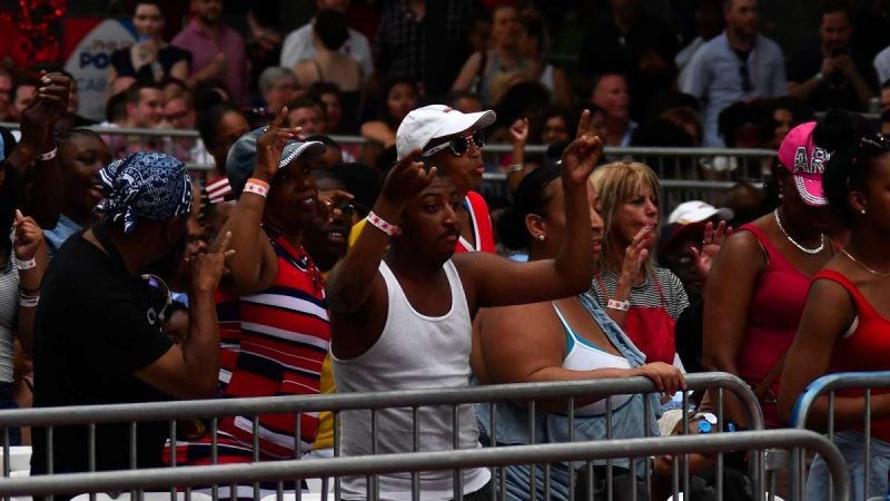Members of the audience in the seated section enjoy the music during the Fourth of July concert on the Parkway.