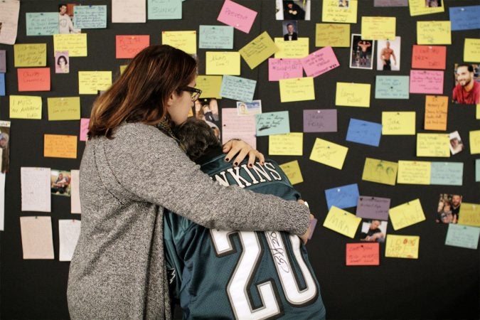 The memories of overdose victims are postedont a Memory Wall at the Regional Candlelight Vigil at Camden Waterfront Stadium on October 14, 2017. (Bastiaan Slabbers for WHYY)
