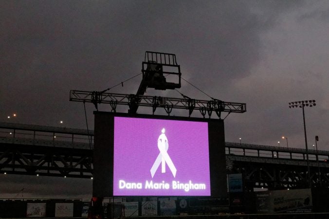 Names of 892 overdose victims are displayed on a Jumbotron during the Regional Candlelight Vigil at Camden Waterfront Stadium on October 14, 2017. (Bastiaan Slabbers for WHYY)