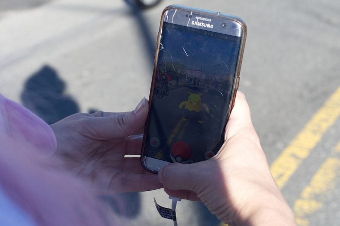 A gamer attempt to score some points at the Pokémon Scavenger Hunt, during Philly Free Streets event, Saturday, Oct. 28, 2017. (Bastiaan Slabbers for WHYY)