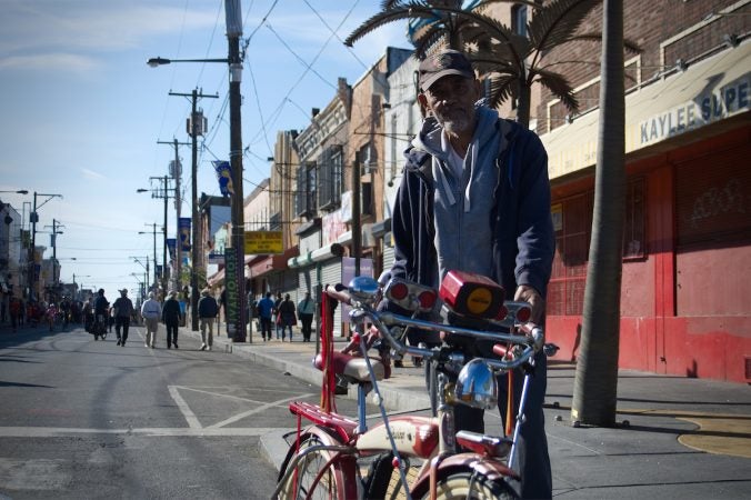 Hector Colon stands next to a vintage cruiser during Philly Free Streets,  Saturday, Oct. 28, 2017. (Bastiaan Slabbers for WHYY)