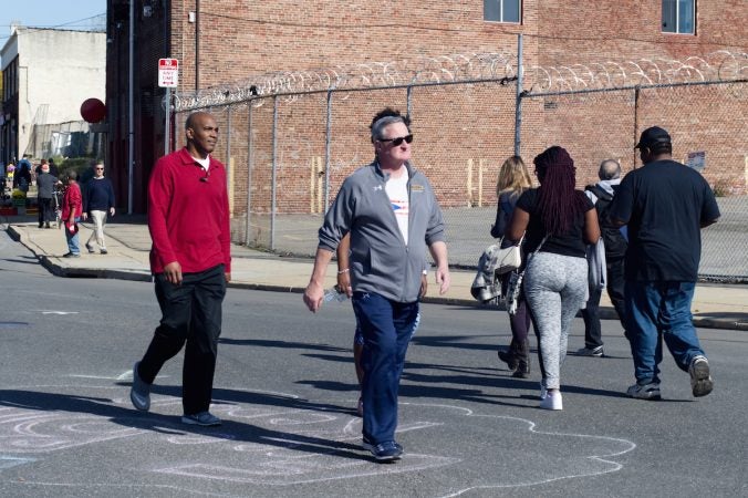 Philadelphia Mayor Jim Kenney keeps up the pace as he power-walks the route of Philly Free Streets, Saturday, Oct. 28, 2017. (Bastiaan Slabbers for WHYY)