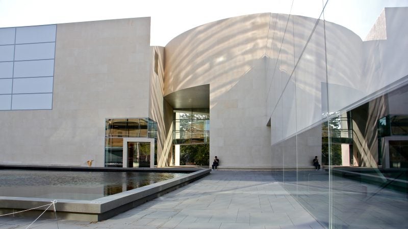 At the Plaza level, the buildings of the arts complex, the Wallace Dance Building and Theater (left), the Arts Tower (right) and the New Music Building (not shown) surround a reflecting pool. (Emma Lee/WHYY)