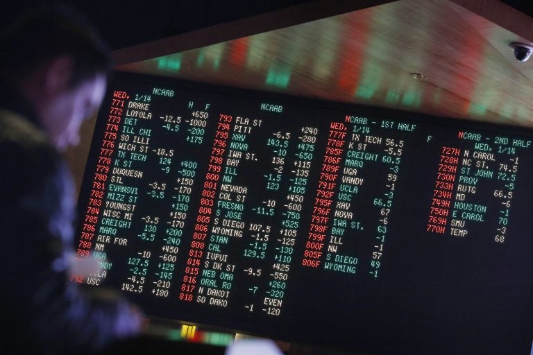 In this Jan. 14, 2015, file photo, odds are displayed on a screen at a sports book owned and operated by CG Technology in Las Vegas. (John Locher/AP Photo, File)