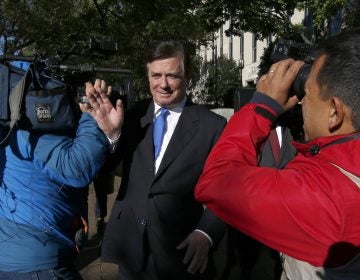 Paul Manafort makes his way through television cameras as he walks from Federal District Court in Washington, Monday, Oct. 30, 2017. Manafort, President Donald Trump's former campaign chairman, and Manafort's business associate Rick Gates have pleaded not guilty to felony charges of conspiracy against the United States and other counts. (AP Photo/Alex Brandon)