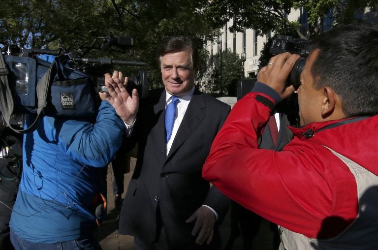 Paul Manafort makes his way through television cameras as he walks from Federal District Court in Washington, Monday, Oct. 30, 2017. Manafort, President Donald Trump's former campaign chairman, and Manafort's business associate Rick Gates have pleaded not guilty to felony charges of conspiracy against the United States and other counts. (AP Photo/Alex Brandon)