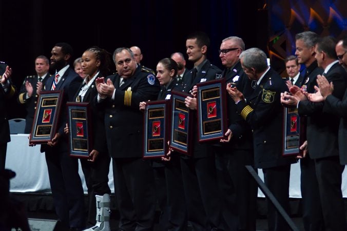 Recipients of Police Officer of the Year awards are recognized on stage during the General Assembly of the International Association of Chiefs of Police convention in Philadelphia. (Bastiaan Slabbers for WHYY)