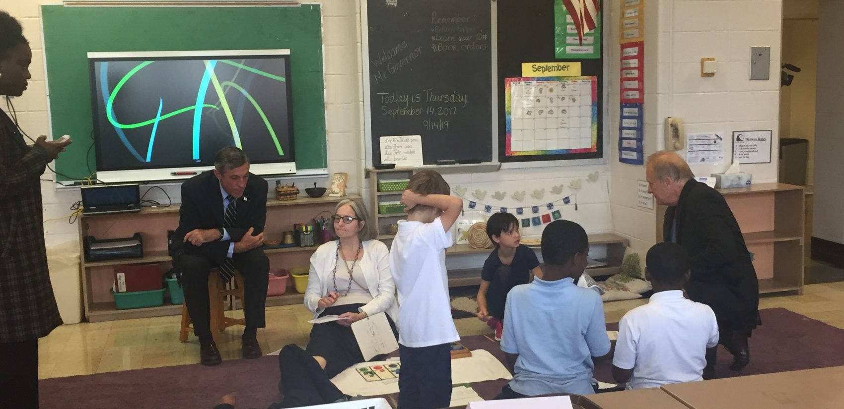 Gov. John Carney (seated) recently visited Bancroft Elementary, which has barely one-third of its seats filled. Carney said Christina School District leaders must make 