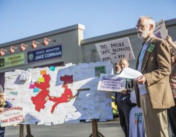 Advocates supporting the lawsuit that eventually overturned the state's congressional map rallied outside Senate Majority Leader Jake Corman's office in Centre County in October 2017.  (Min Xian/Keystone Crossroads) 