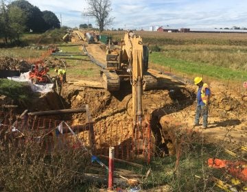 A backhoe digs a path for a pipeline in Pennsylvania