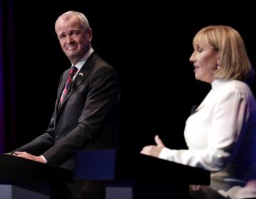 Democratic nominee Phil Murphy (left) listens as Republican nominee Lt. Gov. Kim Guadagno (right) answers a question during a gubernatorial debate at the New Jersey Performing Arts Center, Tuesday, Oct. 10, 2017, in Newark, N.J.