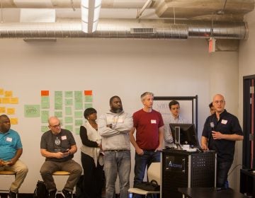 Teams presented their ideas to use technology to help formerly incarcerated people return to their communities at a 'hackathon' in Philadelphia organized by The Reentry Project. (Brad Larrison for WHYY)