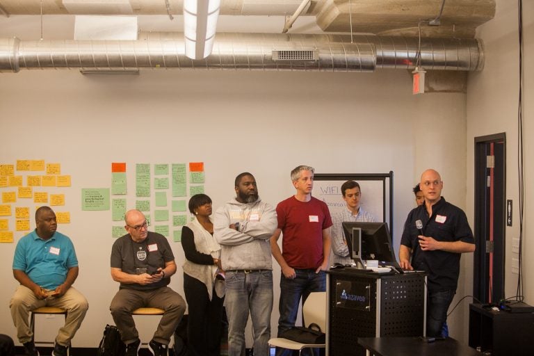 Teams presented their ideas to use technology to help formerly incarcerated people return to their communities at a 'hackathon' in Philadelphia organized by The Reentry Project. (Brad Larrison for WHYY)