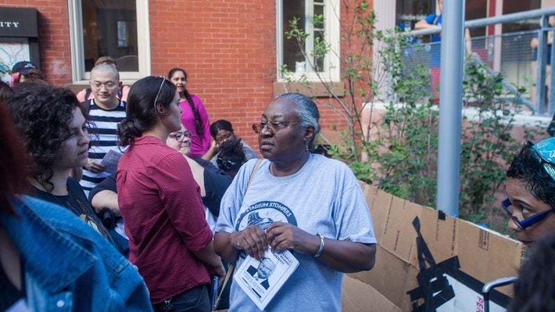 People gather for a protest outside of a trustees meeting at Temple University