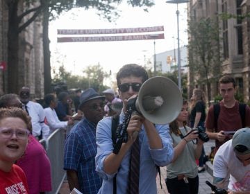 A man with a megaphone during a protest at Temple University