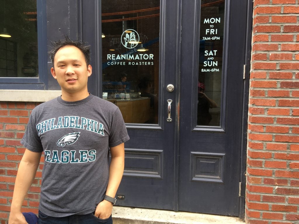 Abe Kwon outside of his favorite neighborhood coffee shop, ReAnimator Coffee in Fishtown.