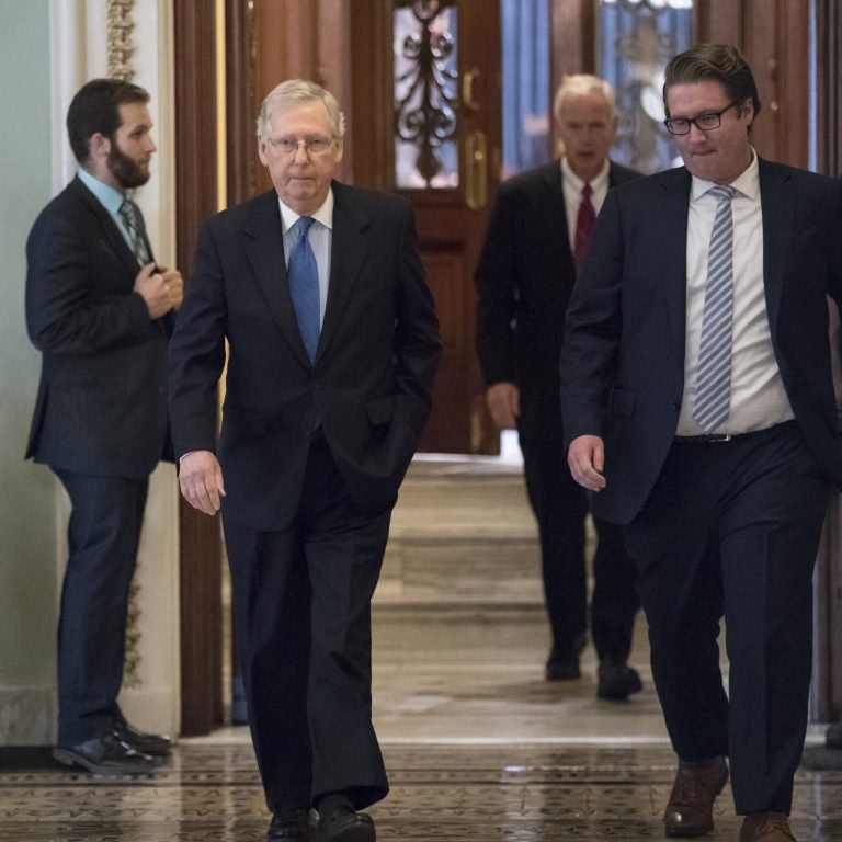 Senate Majority Leader Mitch McConnell walks through the hallways of the Capitol