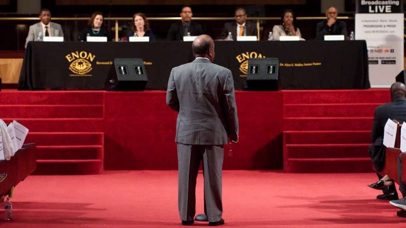 Retired educator Craig Brown asks a question of the panel during the Courageous Conversations: Reimagining Race and Education forum at Enon Tabernacle Church, on Thursday. (Bastiaan Slabbers for WHYY)